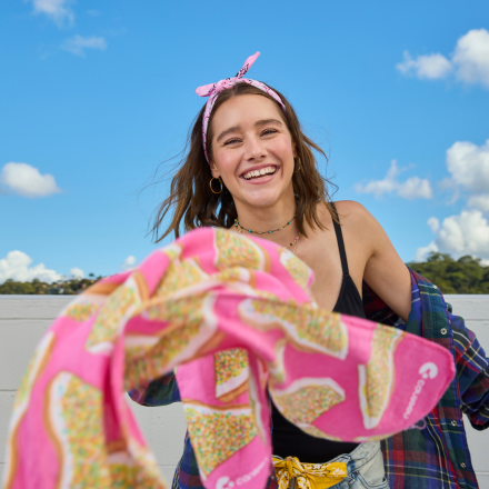 Girl throwing bandanna